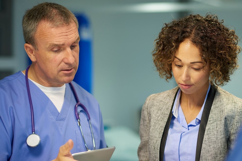 Doctor talking to nurse in a hospital